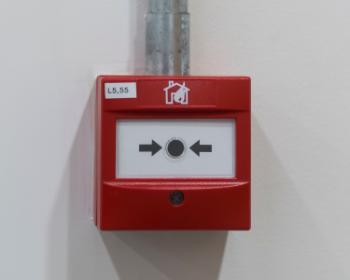 Photo of red fire alarm button 